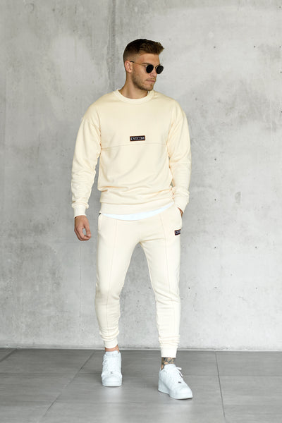 BEIGE PATCH SWEATPANTS